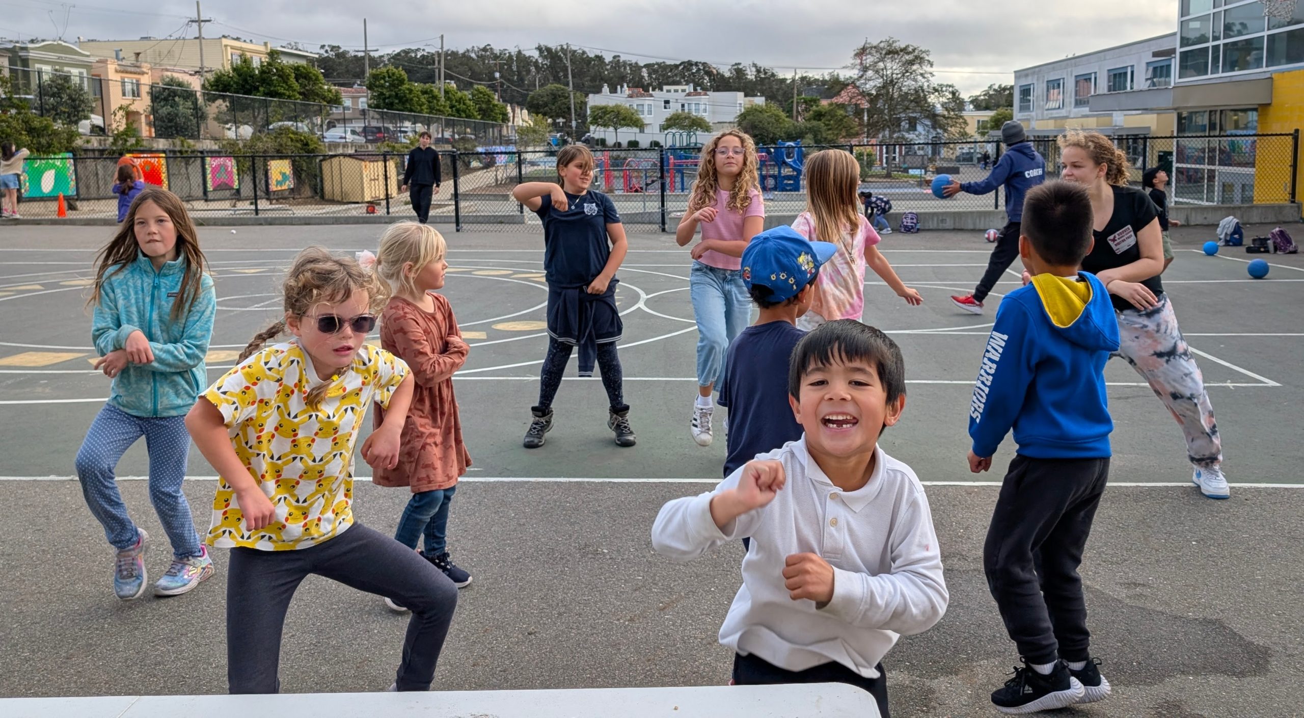 Children running and playing together in a schoolyard.