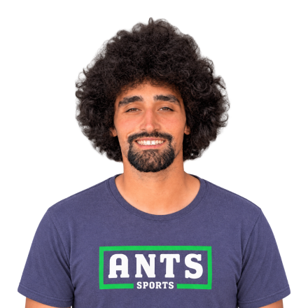 An ANTS Sports coach with curly hair and a beard.