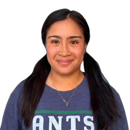 An ANTS Sports coach with dark hair in two ponytails.